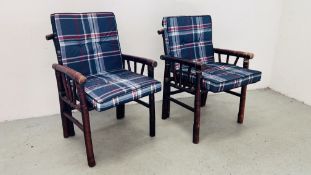 A PAIR OF BAMBOO ARMCHAIRS WITH CHECKED CUSHIONS.