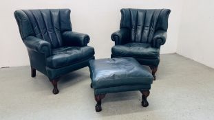 A PAIR OF MODERN BOTTLE GREEN LEATHER WING BACK FIRE SIDE ARMCHAIRS ON BALL AND CLAW FEET ALONG