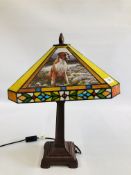 A TIFFANY STYLE TABLE LAMP, THE PANELS DEPICTING BOXER DOGS - SOLD AS SEEN.