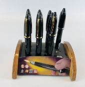 A COLLECTION OF 10 LIGHTERS IN THE FORM OF FOUNTAIN PENS IN ORIGINAL DISPLAY STAND.