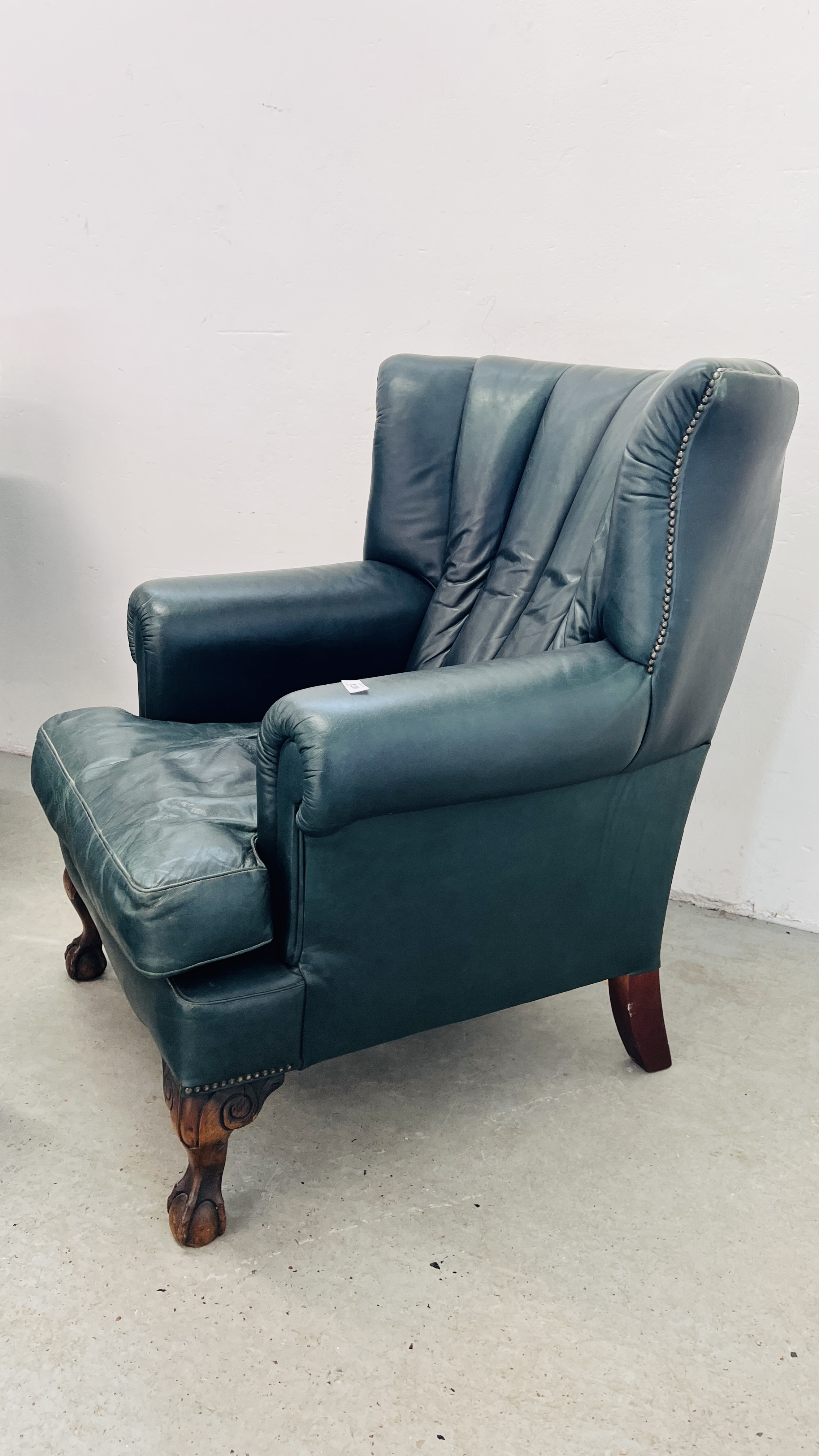 A PAIR OF MODERN BOTTLE GREEN LEATHER WING BACK FIRE SIDE ARMCHAIRS ON BALL AND CLAW FEET ALONG - Image 10 of 13