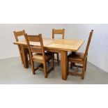 A SOLID OAK CHUNKY EXTENDING DINING TABLE ALONG WITH A SET OF 4 SOLID OAK DINING CHAIRS WITH TAN