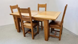 A SOLID OAK CHUNKY EXTENDING DINING TABLE ALONG WITH A SET OF 4 SOLID OAK DINING CHAIRS WITH TAN