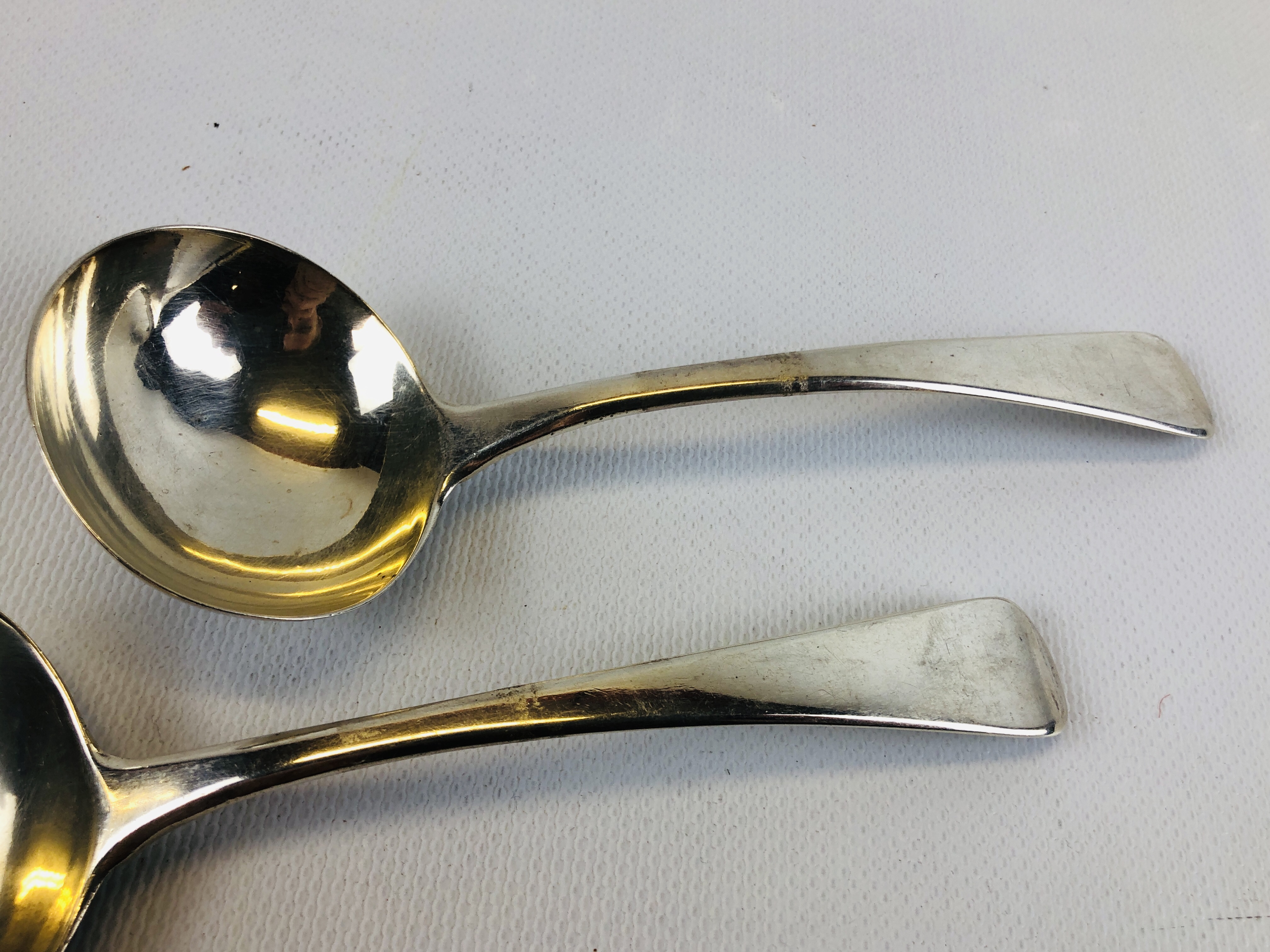 A PAIR OF GEORGE III OLD ENGLISH PATTERN SILVER SAUCE LADLES. - Image 4 of 7