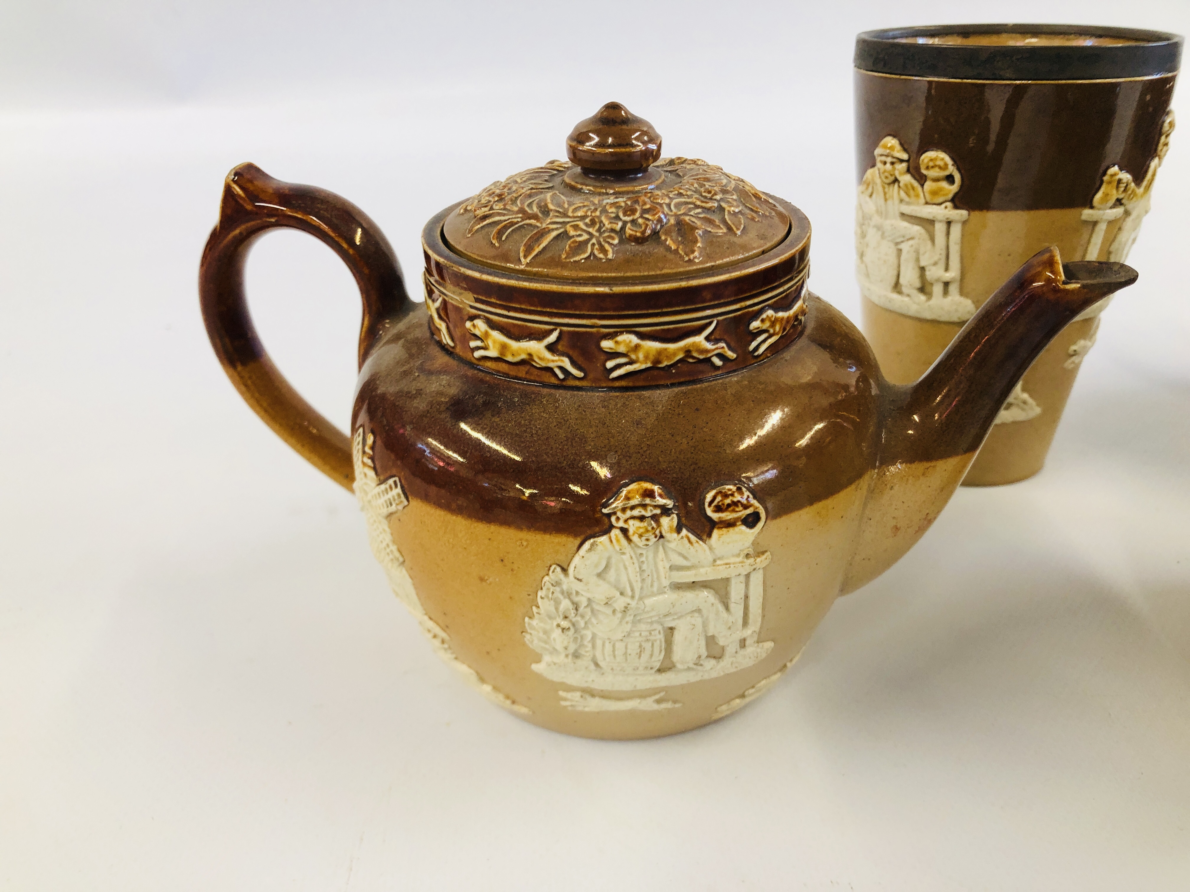 FOUR PIECES DOULTON TO INCLUDE TWO TEA POTS, TOBACCO JAR AND SILVER RIMMED BEAKER A/F. - Image 4 of 7