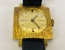 A LADIES RETRO SARCAR WRIST WATCH WITH GOLD COLOURED DIAL ON LEATHER STRAP.