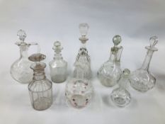 A COLLECTION OF 8 ASSORTED VINTAGE GLASS DECANTERS.