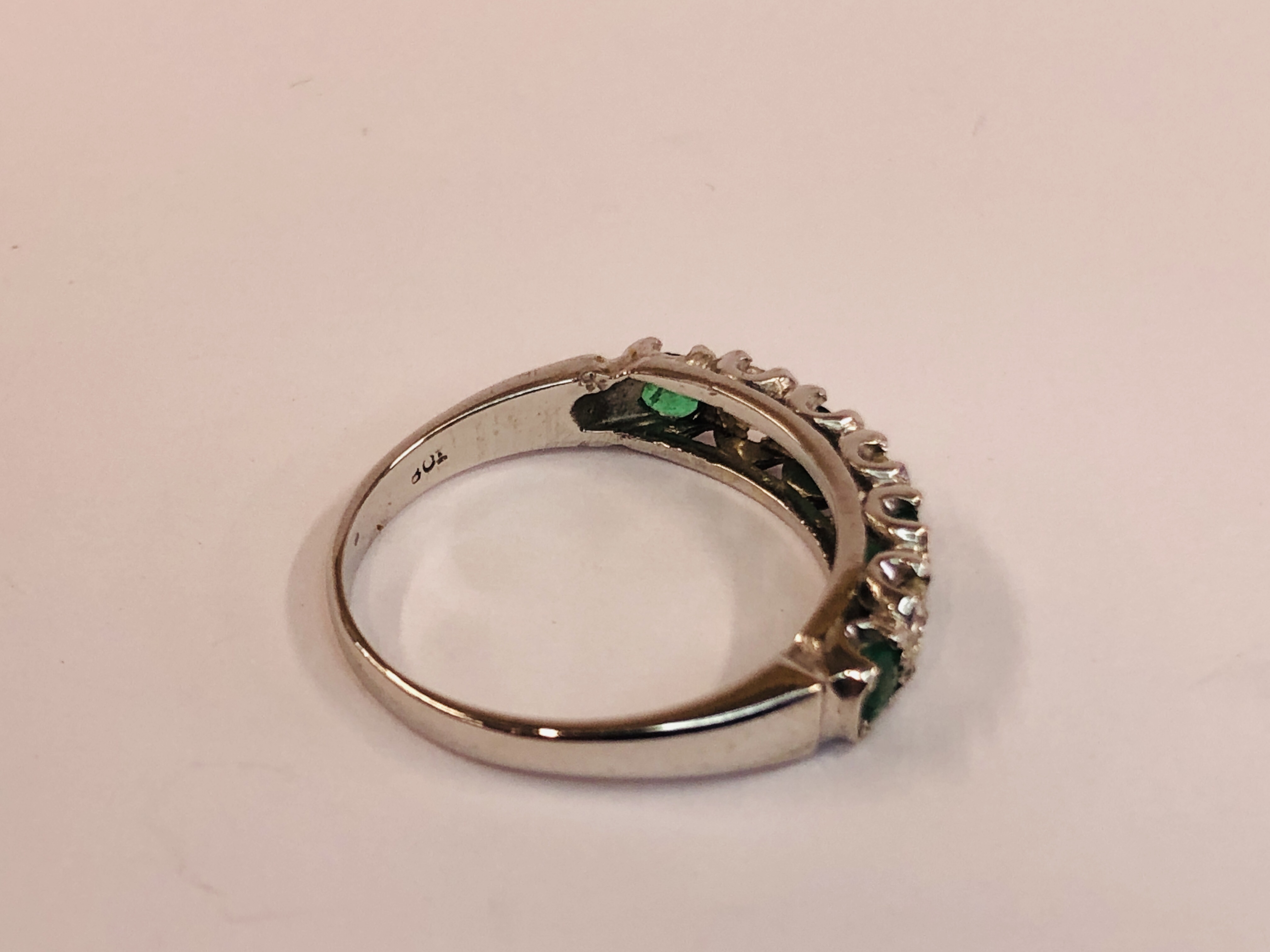 AN 18CT WHITE GOLD EMERALD AND DIAMOND HALF HOOP ETERNITY RING. - Image 4 of 7