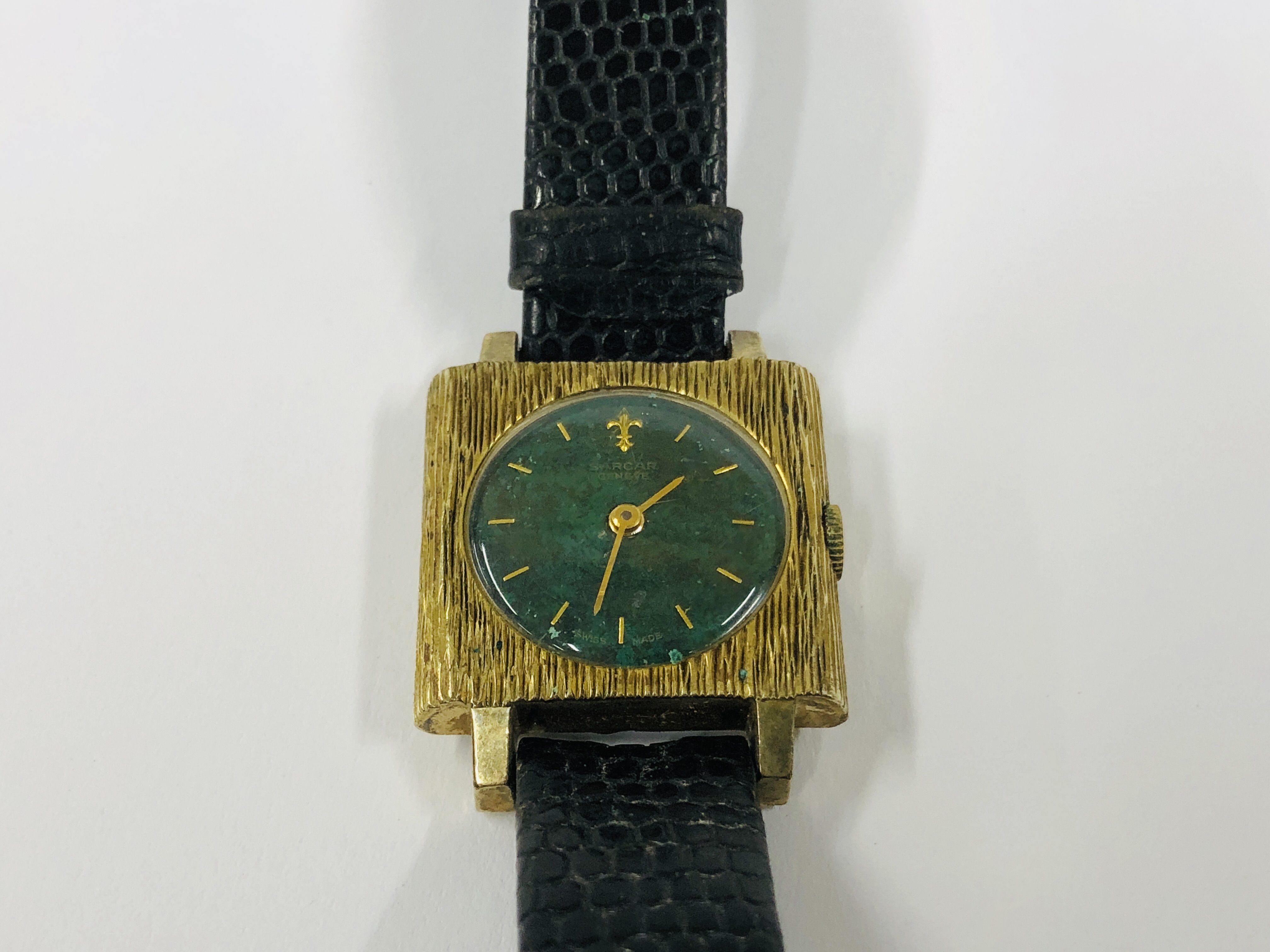 A LADIES RETRO SARCAR WRIST WATCH WITH GREEN COLOURED DIAL ON LEATHER STRAP.