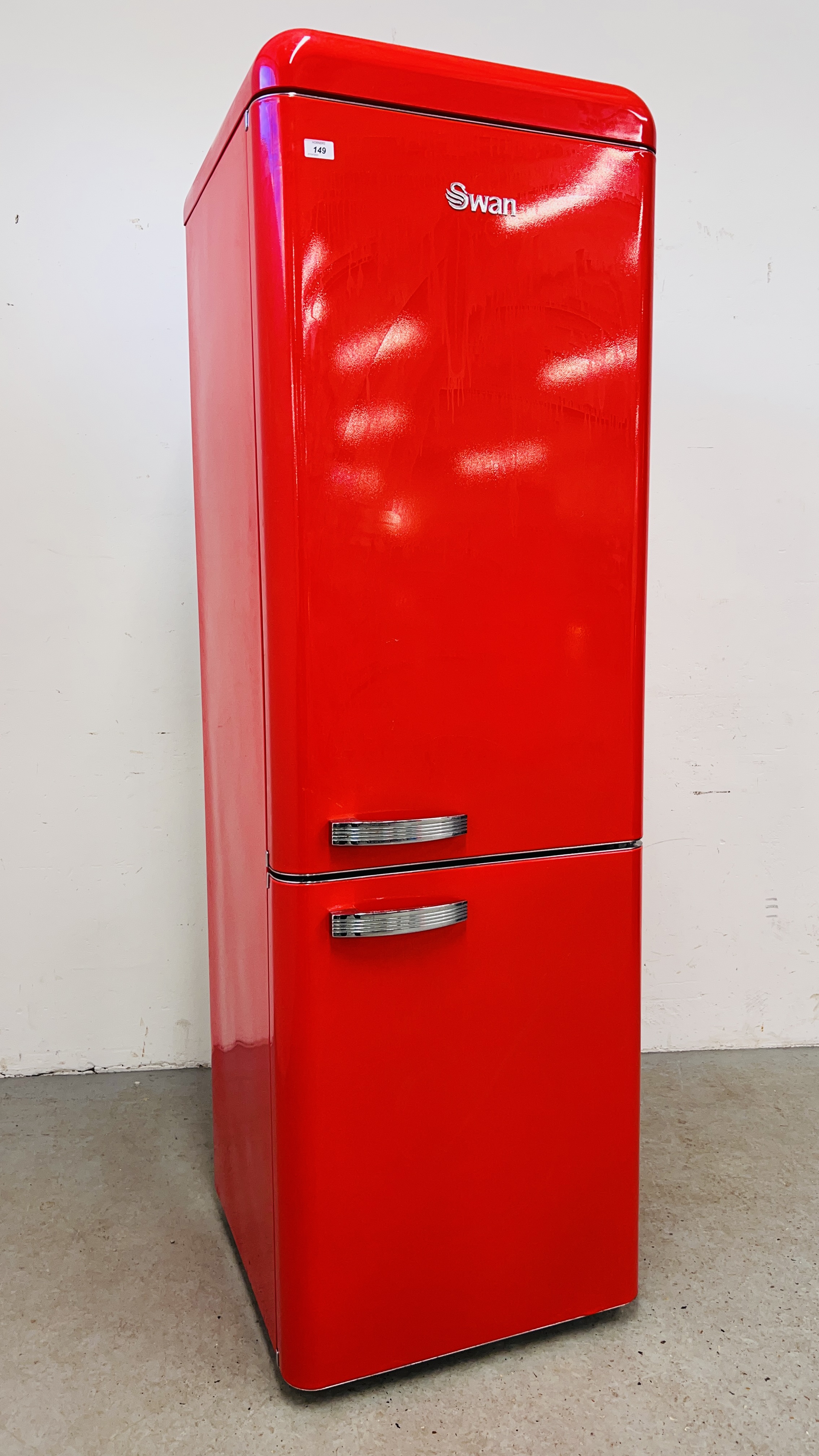 A SWAN RETRO STYLE RED FINISH FRIDGE FREEZER - SOLD AS SEEN.