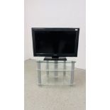 SONY 32 INCH TV MODEL KDL-3255500 ALONG WITH A MODERN 3 TIER CLEAR GLASS STAND - SOLD AS SEEN.