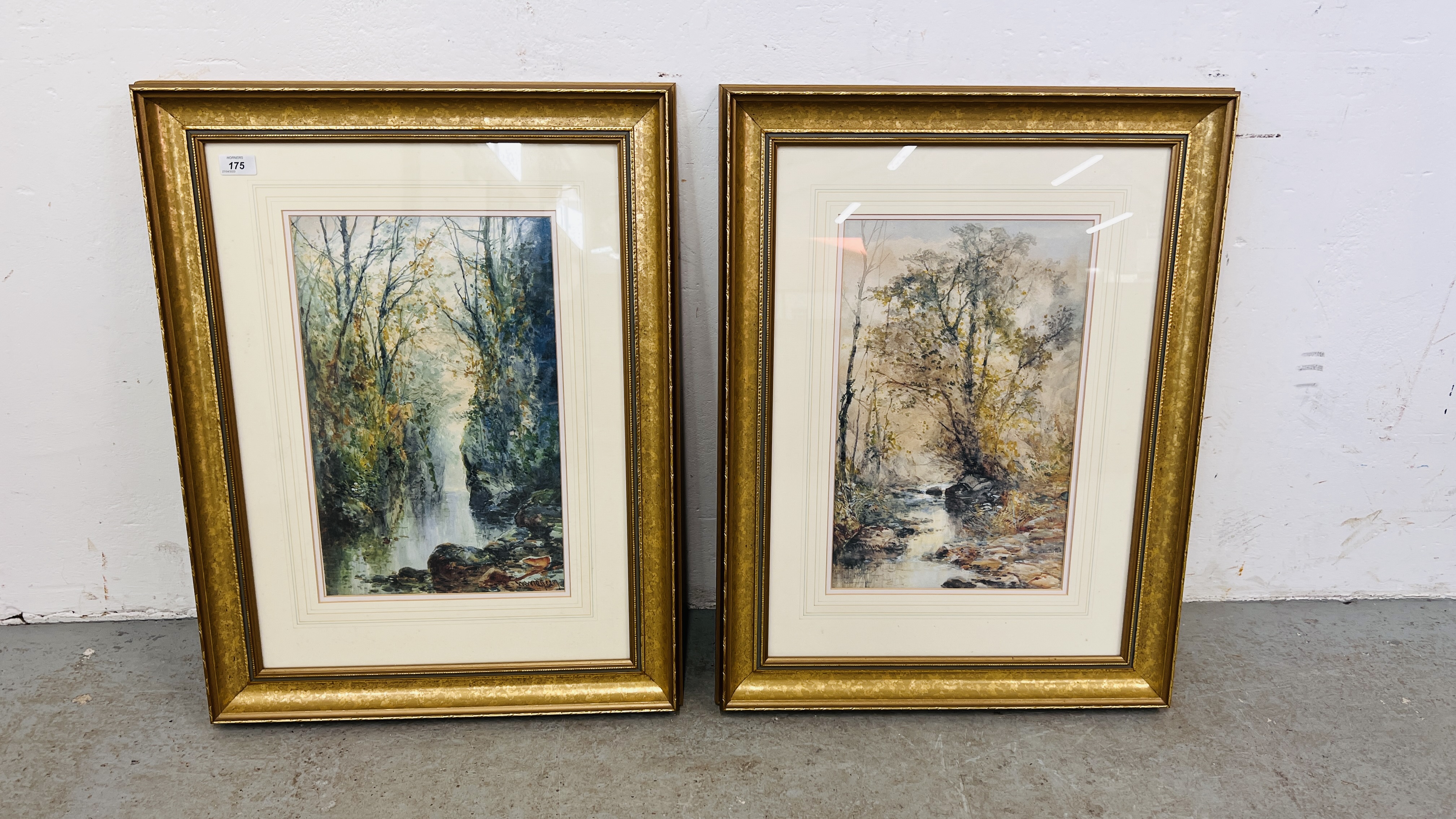 TWO FRAMED AND MOUNTED WATERCOLOURS BEARING SIGNATURE "WOODLAND STREAMS" EACH 45 X 28.5CM.
