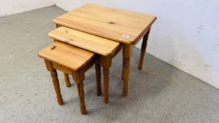 NEST OF THREE GRADUATED PINE TABLES.