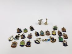 A COLLECTION OF VINTAGE SILVER AND WHITE METAL ENAMELLED CHARMS APPROXIMATELY 25.