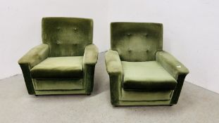 A PAIR OF GREEN UPHOLSTERED 1960's ARM CHAIRS.