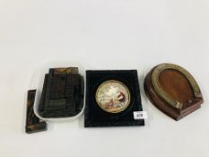 A VINTAGE FRAMED POT LID DEPICTING FARMING SCENE ALONG WITH A HORSESHOE CRIBBAGE BOX AND CONTENTS