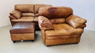 A MODERN TAN LEATHER TWO SEATER SOFA ALONG WITH A MATCHING ARMCHAIR AND FOOTSTOOL.