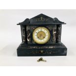 A VINTAGE SLATE AND MARBLE MANTEL CLOCK WITH COLUMN DETAIL.