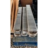 SEVEN CONCRETE 1 METRE DRAINAGE GULLEYS WITH STEEL GRATE TOPS.