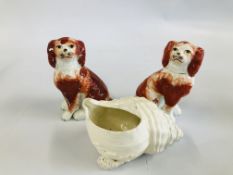 A PAIR OF STAFFORDSHIRE STYLE SPANIELS AND A VINTAGE WHITE GLAZED SHELL ORNAMENT.