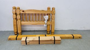 A SINGLE PINE BED FRAME.