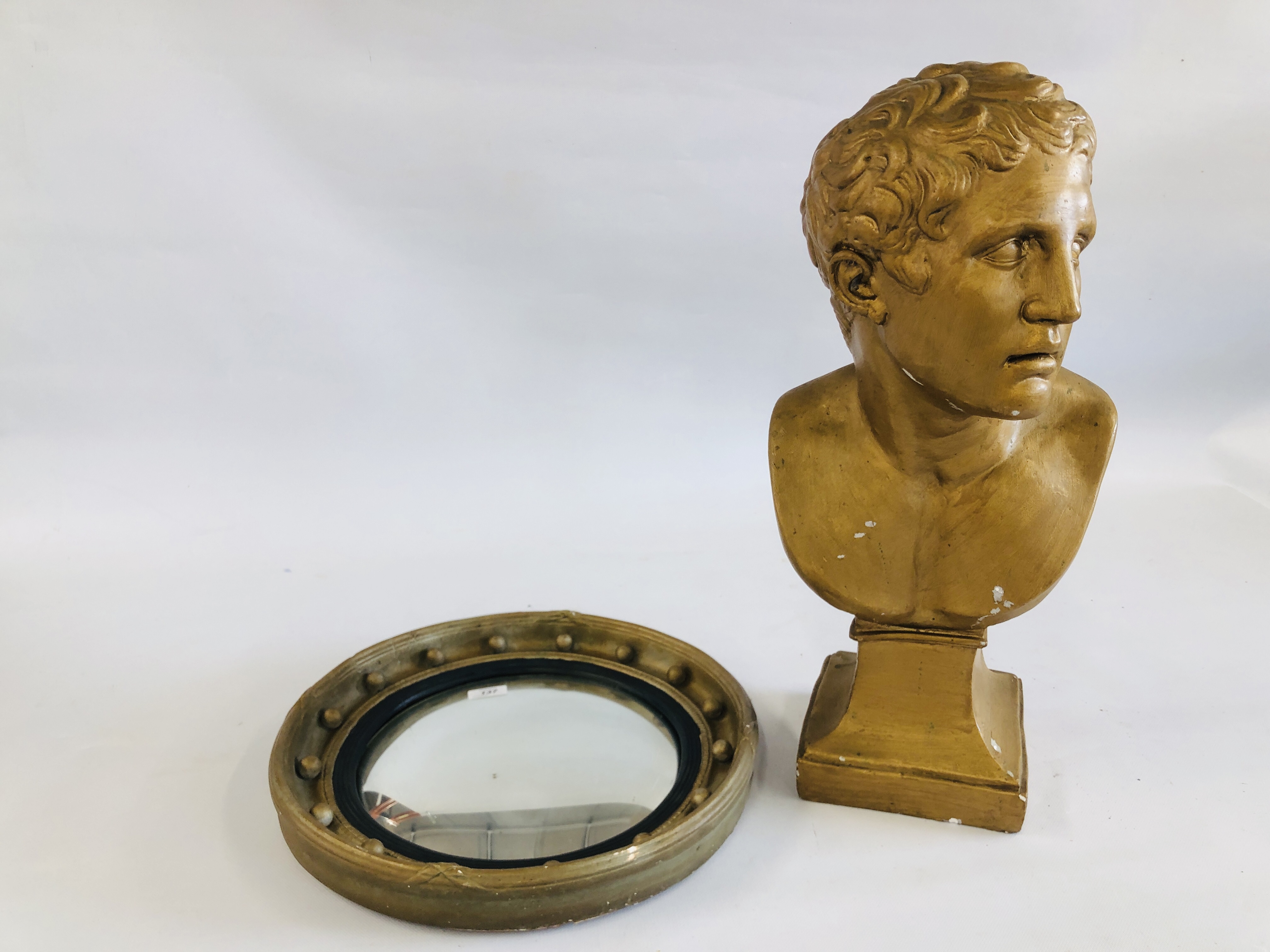 A CIRCULAR CONVEX WALL MIRROR, PLASTER BUST.