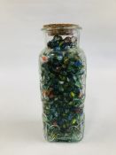 A LARGE GLASS SWEET JAR FULL OF VINTAGE GLASS MARBLES 32CM. H.