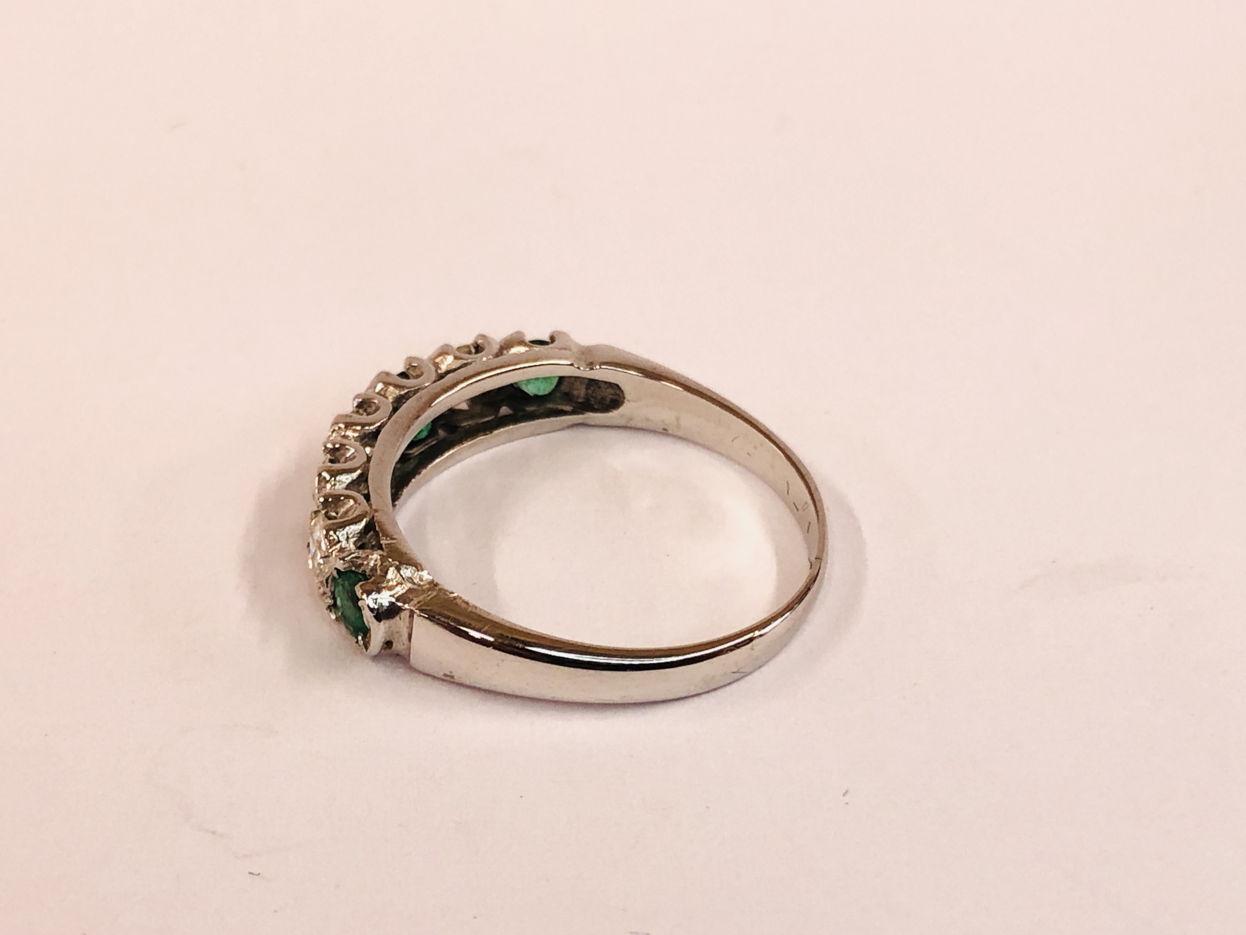 AN 18CT WHITE GOLD EMERALD AND DIAMOND HALF HOOP ETERNITY RING. - Image 3 of 7