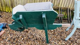 A VINTAGE WOODEN WHEELBARROW.