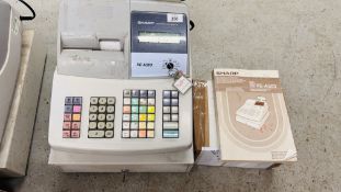 A SHARP ELECTRONIC CASH REGISTER MODEL XE-A303 WITH INSTRUCTION BOOK AND TILL ROLLS - KEYS WITH