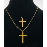 A VINTAGE CROSS & CHAIN MARKED 9CT ALONG WITH A FURTHER 9CT GOLD CROSS.