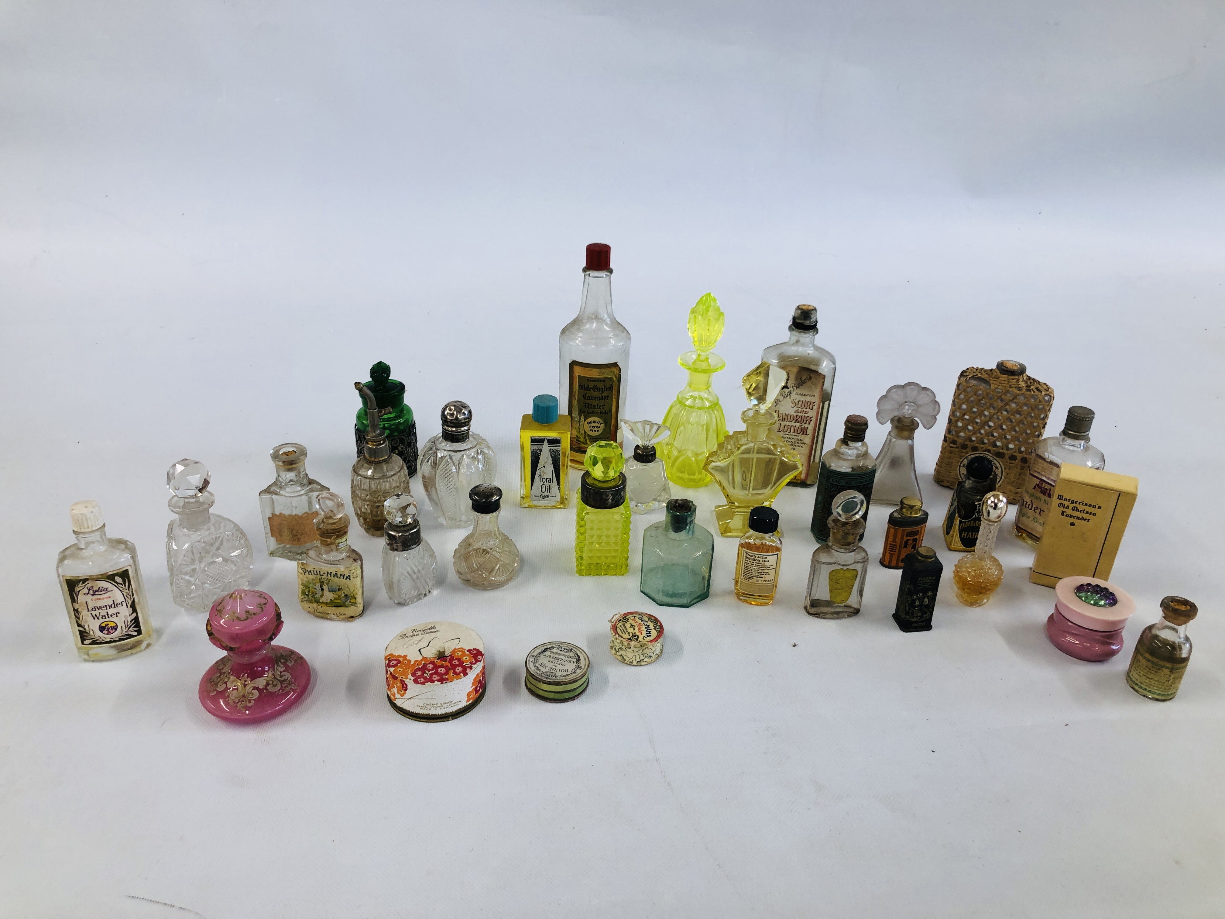 COLLECTION OF VINTAGE PERFUME BOTTLES INCLUDING SILVER TOPPED.