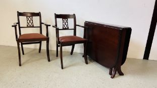 A REPRODUCTION HARD WOOD DROP LEAF TABLE W 95CM X H 75CM ALONG WITH TWO SIMILAR CARVER CHAIRS.
