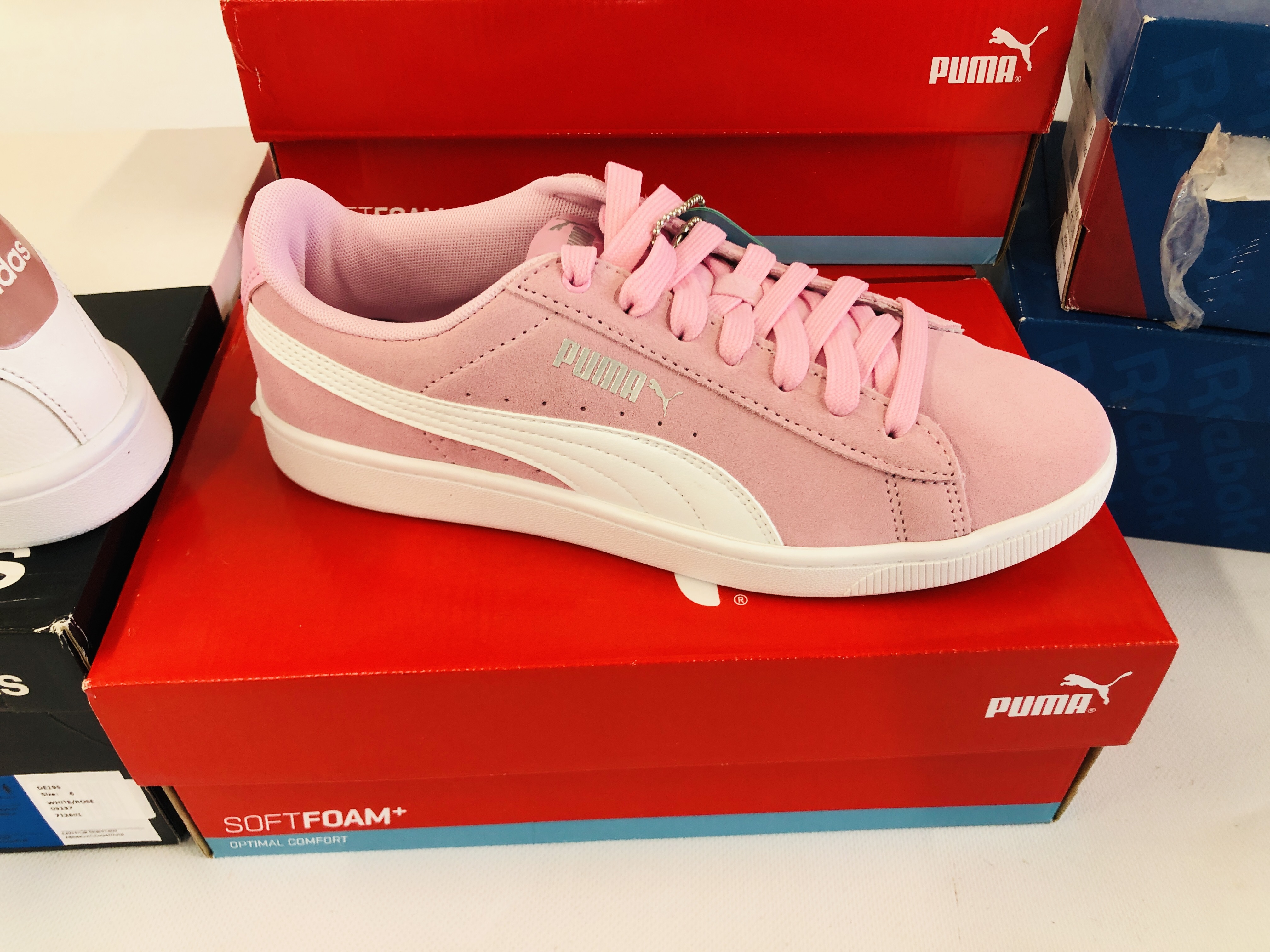 THREE PAIRS OF BOXED NEW PUMA SOFT FOAM TRAINERS + PAIR OF ADIDAS TRAINERS AND TWO PAIRS OF REEBOK - Image 4 of 7