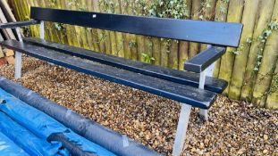 A LARGE BENCH ON STEEL LEGS AND BLACK PAINTED WOODWORK L 244CM.