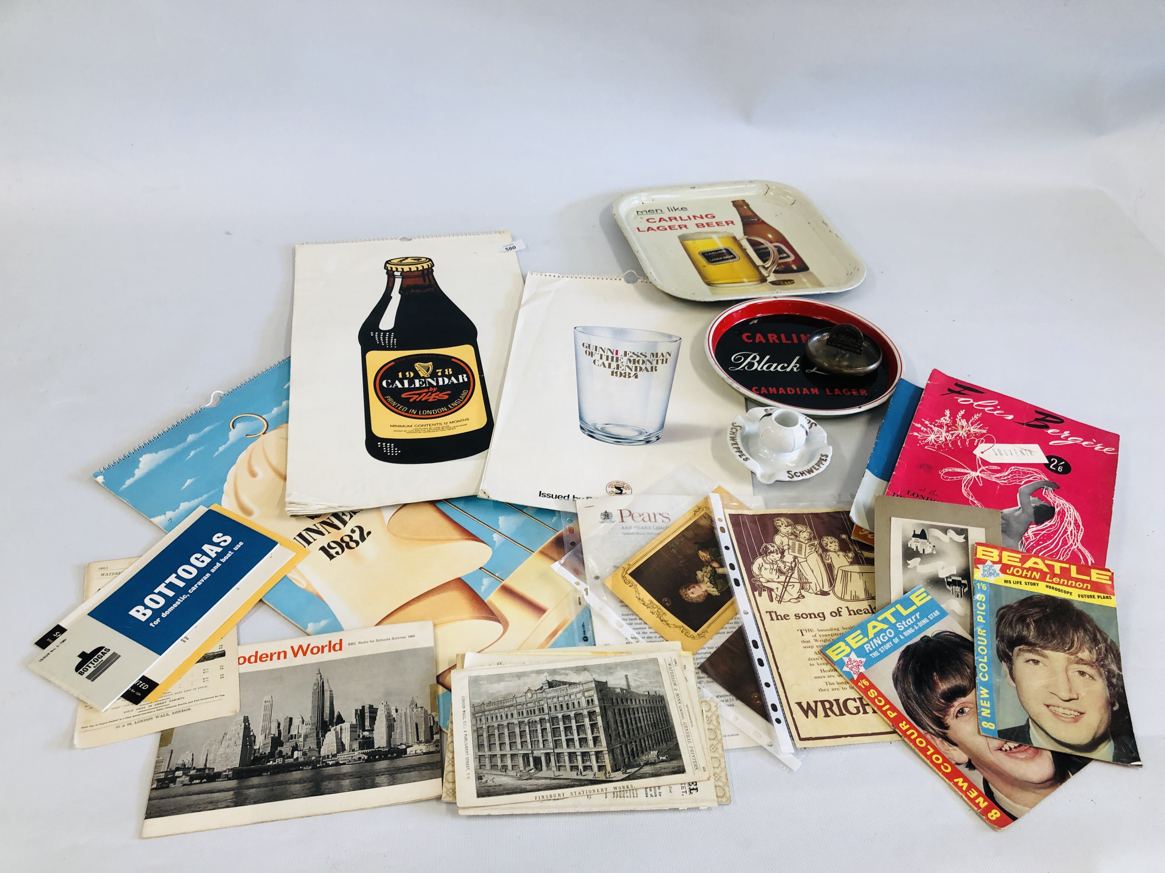 A COLLECTION OF VINTAGE EPHEMERA TO INCLUDE 70'S, 80'S GUINNESS CALENDARS, BEATLES CATALOGUE,