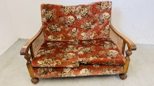 A TWO SEATER BERGERE SOFA