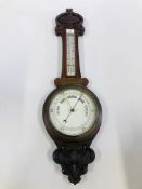 AN OAK WALL HANGING BAROMETER H 86CM.