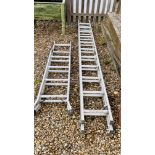 A SET OF ABRU ELEVEN TREAD ALUMINIUM DOUBLE EXTENSION LADDERS AND ABRU ALUMINIUM THREE WAY