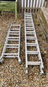 A SET OF ABRU ELEVEN TREAD ALUMINIUM DOUBLE EXTENSION LADDERS AND ABRU ALUMINIUM THREE WAY