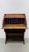 A SMALL OAK ROLL TOP WRITING BUREAU WITH BOOKSHELF TO BASE, W 77CM, D 52CM, H 108CM.