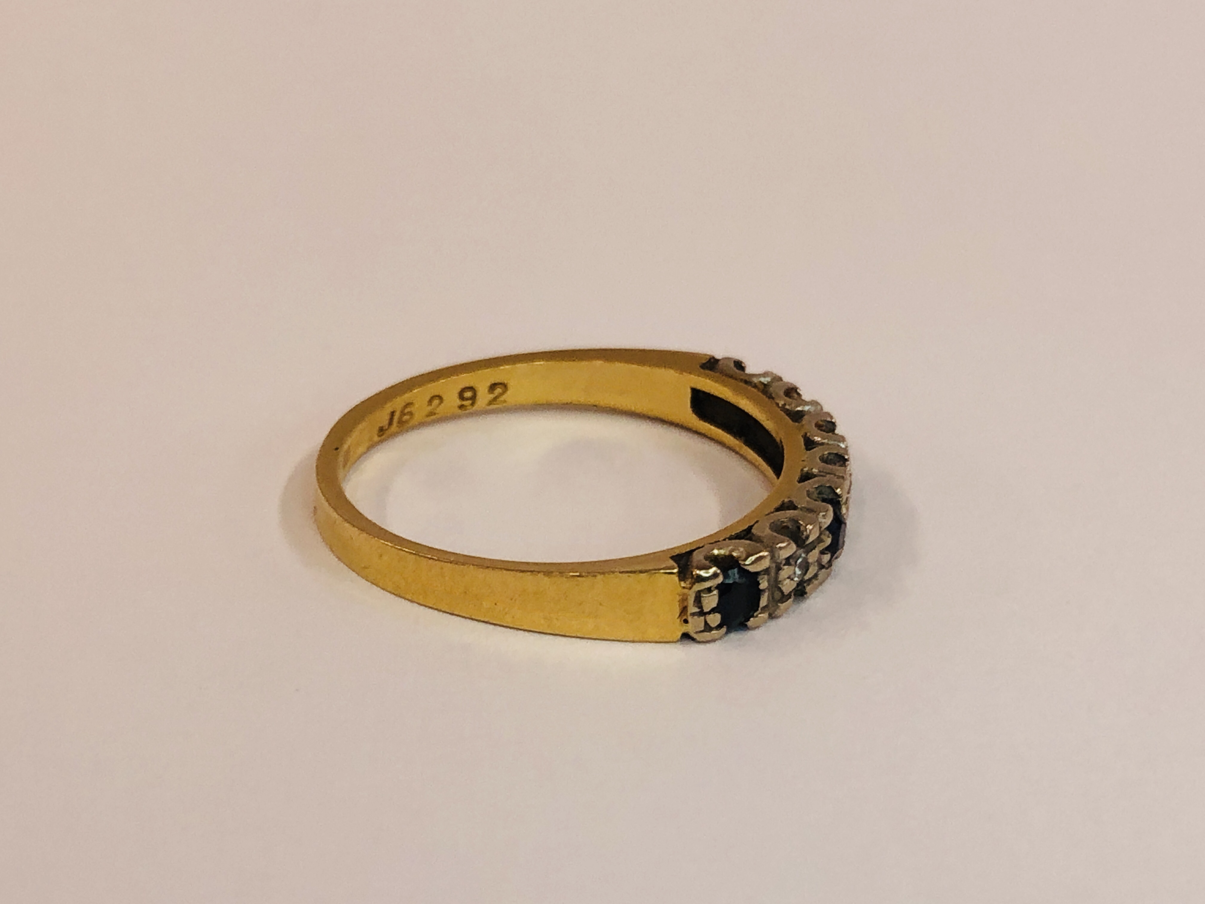 AN 18CT GOLD SAPPHIRE & DIAMOND HALF ETERNITY RING. - Image 6 of 8