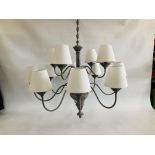 A GREY PAINTED SHABBY CHIC STYLE CEILING LIGHT HAVING 12 INDIVIDUAL BRANCHES WITH WHITE SHADES -