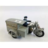 A REPRODUCTION MOTORCYCLE POSTMAN MONEY BANK.