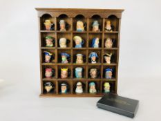 A 25 PIECE MINIATURE TOBY JUG COLLECTION BY PETER JACKSON IN FITTED WOODEN DISPLAY.