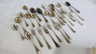 A GROUP OF SILVER CUTLERY COMPRISING SIX SOUP SPOONS AND SIX DESSERT SPOONS MATCHING ALONG WITH