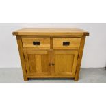 A MODERN LIGHT OAK TWO DOOR TWO DRAWER SIDEBOARD, W 107CM X D 43.5CM X H 90CM.