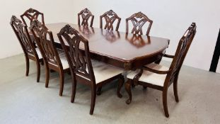 A REPRODUCTION MAHOGANY TWIN PILLAR DINING TABLE WITH THREE EXTRA LEAVES,