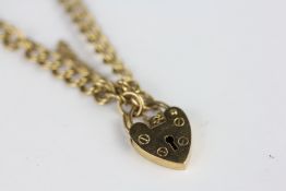 A 9CT GOLD HEART LOCK BRACELET AND SAFETY CHAIN.