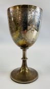 AN IMPRESSIVE SILVER TROPHY CUP DECORATED WITH FLOWERS ON A CIRCULAR SPREADING BASE,